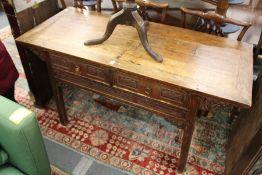 A 19th century Chinese carved wood altar table with two drawers.