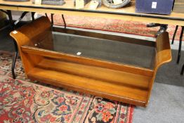 A stylish teak two tier coffee table with curving ends and glass top.