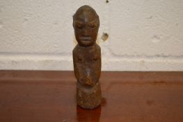A carved wood figure.