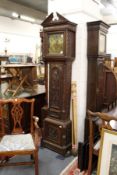 An 18th century long case clock with square brass dial and carved oak case (alterations).