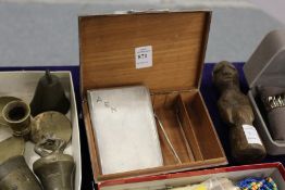 An engine turned silver cigarette case, a plated cigarette box and sugar tongs.