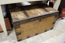 A metal bound pine trunk.