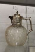 A good cut glass claret jug with plated mounts.
