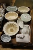 A small collection of jelly moulds and other kitchenalia.