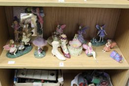 Decorative resin models of fairies and similar items.
