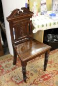 A Victorian mahogany hall chair.