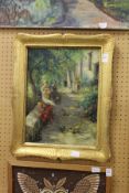 'Two Women Seated on a Wall' oil on board, in a decorative gilt frame.