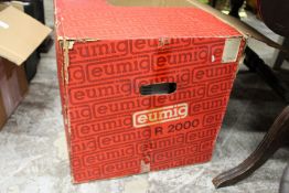 A Eumig projector, boxed.