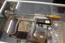 Arnold & Sons, a vet's tool together with a hose tooth rasp.