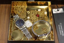 A box of costume jewellery and Concorde passenger tags.