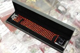 A decorative bracelet, boxed.