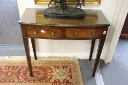 A mahogany two drawer bow fronted side table.