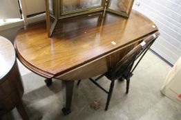 A modern drop leaf dining table.