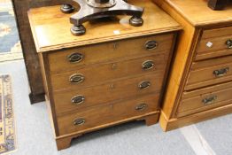 A small mahogany four drawer chest.