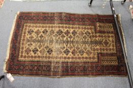 A small Persian prayer rug (worn).