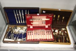 Three canteens of cutlery.