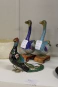 Two Chinese cloisonne geese and a similar peacock.