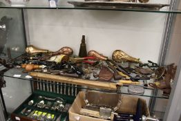 A good collection of shooting related items to include copper powder flasks, gun rack etc. etc.