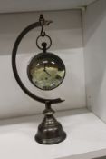 A novelty hanging clock / compass.