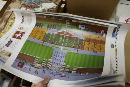 A small group of unframed posters.