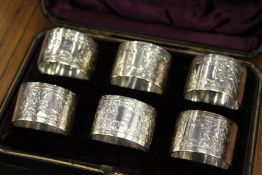 A cased set of six silver napkin rings.