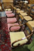 A set of six Regency style brass inlaid mahogany dining chairs, two with arms.