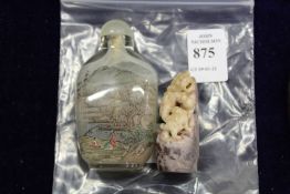 A Chinese glass snuff bottle and a carved group.