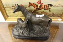 A good modern bronze sculpture, a mare and foal, on a marble base.