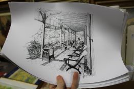 A small group of unframed posters.