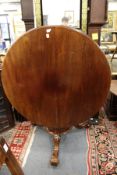 A Victorian mahogany circular tilt top breakfast table.