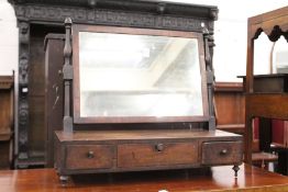 A George III mahogany dressing table mirror with three drawers to the base.