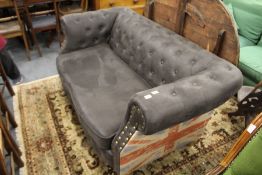 A modern Chesterfield style settee.
