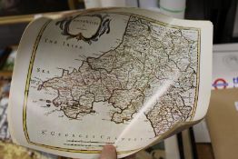 A small group of unframed posters.