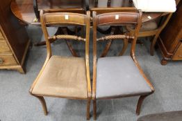 A set of one carver and four single Regency style dining chairs.