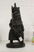 A Benin carved wood figure.