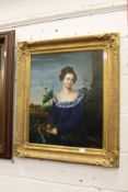 A portrait of a young lady wearing a blue dress, oil on canvas, in a decorative gilt frame.