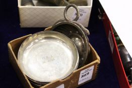 A French wine taster and four small silver dishes.