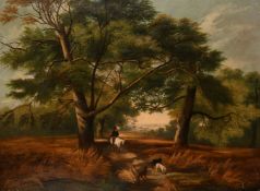 19th century English school, A huntsman on horseback with his dogs on a path through the woods,