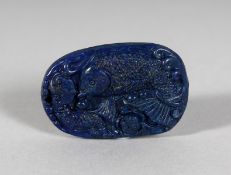A CHINESE CARVED LAPIS PENDANT.