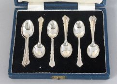A SET OF TWELVE SILVER CASED TEASPOONS. Sheffield 1938.