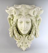 A CARVED STONE WALL POCKET. 17ins long.