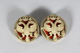 A PAIR OF RUSSIAN SILVER AND ENAMEL EAGLE CUFFLINKS. Stamped 88 and FABERGE MARK. 37gms.