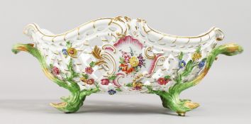 A GOOD MEISSEN OVAL PIERCED TWO-HANDLED BASKET, painted and encrusted with flowers with rustic