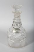 A GEORGIAN CUT GLASS DECANTER AND STOPPER with two silver labels, WHISKY, Edinburgh 1807 and CLARET,