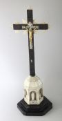 A GOOD MOTHER-OF-PEARL AND EBONY CORPUS ON A CROSS. 16ins high.