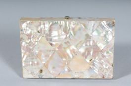 A GOOD VICTORIAN MOTHER-OF-PEARL PURSE with blue interior. 4ins x 2.75ins.