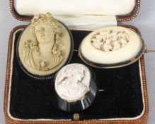 A VICTORIAN LAVA BROOCH with a young lady, and two other brooches (3).