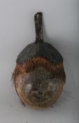 A PACIFIC ISLAND COCONUT HEAD with hair. 6ins.