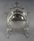 A SILVER PLATE CIRCULAR SHAPED BISCUIT AND CHEESE STAND. 11ins high.