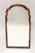 A GOOD TORTOISESHELL MIRROR with shaped top and mirrored panel. 22ins high x 11ins wide.